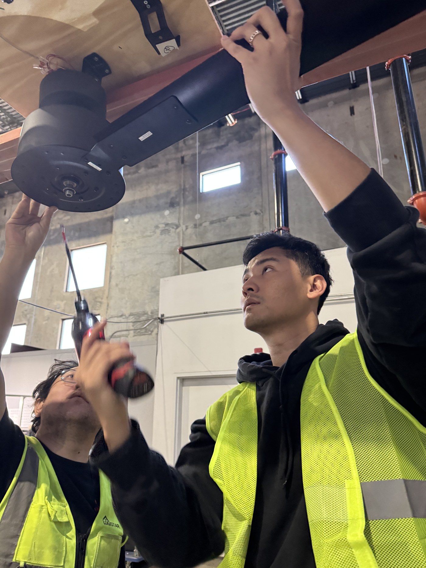 Jay installing equipment on the warehouse floor